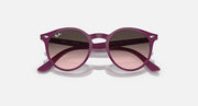 Ray-Ban sunglasses, slightly angled: fuchsia frame with rose gradient lenses