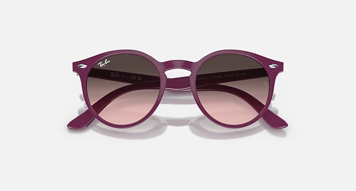 Ray-Ban sunglasses, slightly angled: fuchsia frame with rose gradient lenses