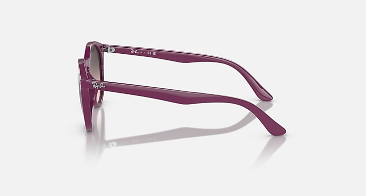 Ray-Ban sunglasses, side profile: fuchsia frame with rose gradient lens