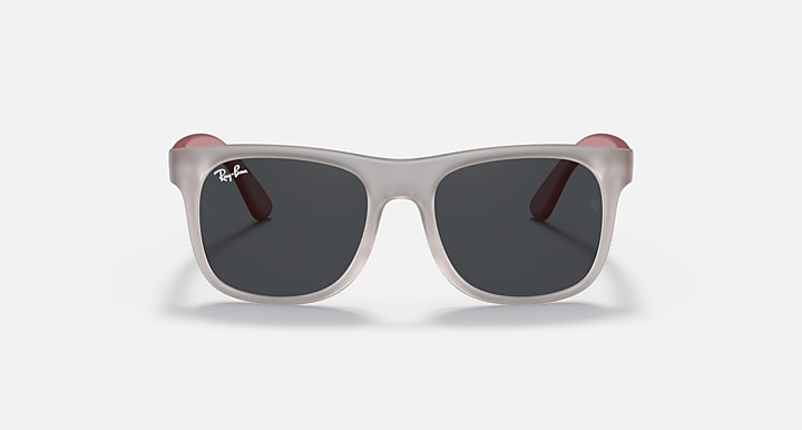 Sunglasses with light gray frames and dark lenses, with burgundy-red top and temples