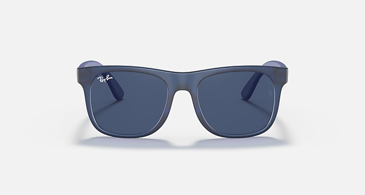 Sunglasses with navy blue frames and dark lenses, featuring curved rubber temple tips