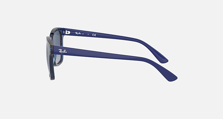 Sunglasses with transparent blue frame, side profile, blue gradient lenses