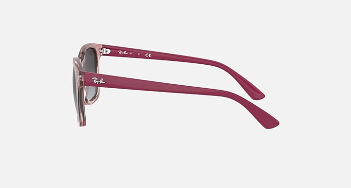 Burgundy sunglasses with dark gray lenses, side temple view