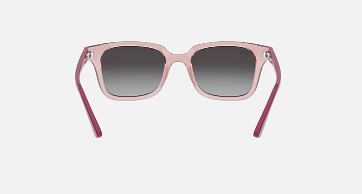 Pink gradient sunglasses with dark gray lenses and curved arms