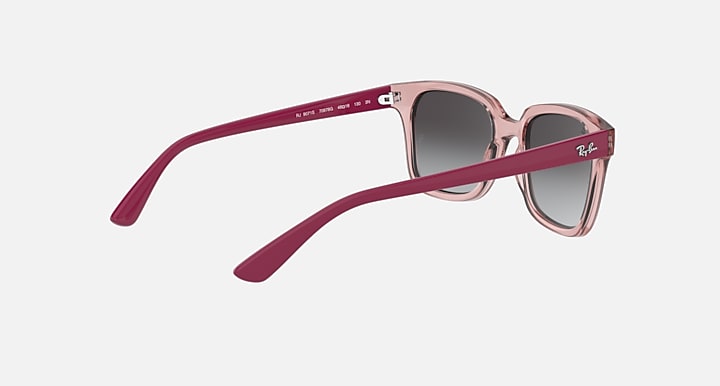 Pink gradient sunglasses with dark gray lenses, angled side profile