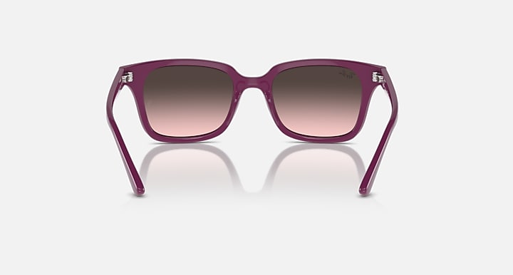 Sunglasses with cherry/pink frame and rose gradient lenses, front view with temples