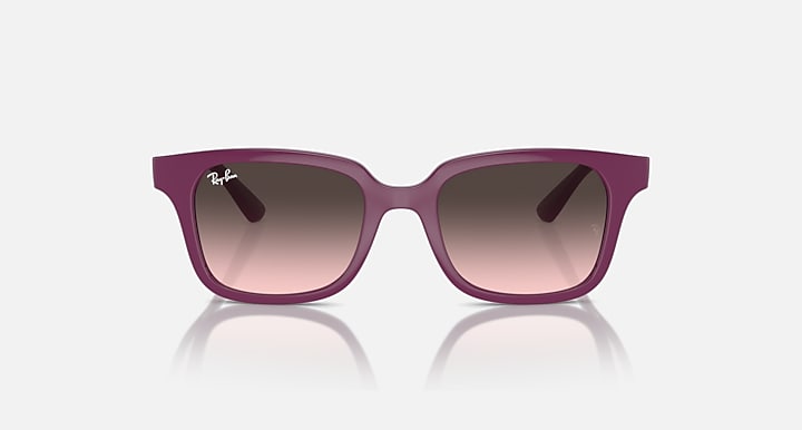 Sunglasses with cherry/pink translucent frame and rose gradient lenses, front view