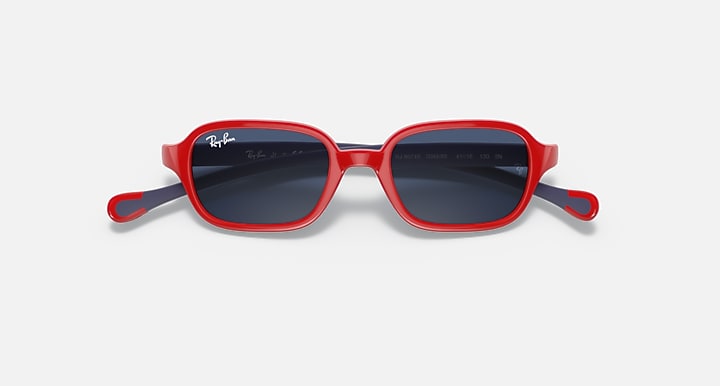 Red kids sunglasses with dark blue lenses and Ray-Ban logo on the temples