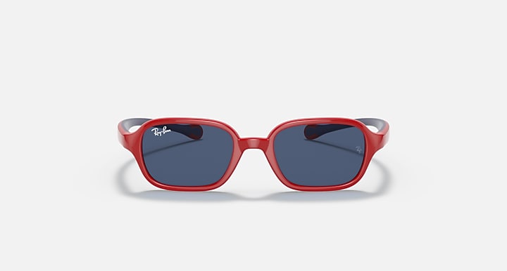 Red kids sunglasses front with dark blue lenses and pinkish rubber temple tips