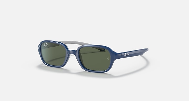 Blue kids sunglasses with green-tinted lenses and light gray temple arms