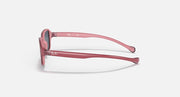 Kids sunglasses side profile, pink frame with dark gray lenses
