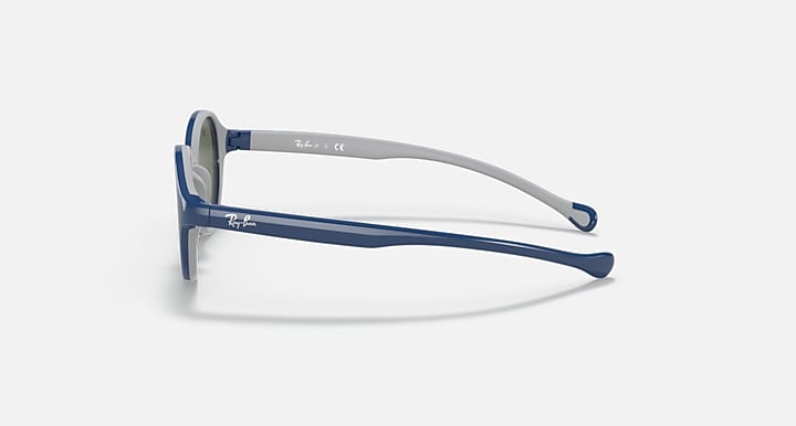 Ray-Ban round sunglasses side view with light gray frame and blue temple tips.