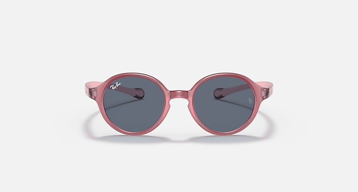 Ray-Ban round sunglasses with rose-pink frame and dark gray lenses.