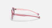 Ray-Ban round sunglasses side view with pale pink frame and curved temple.