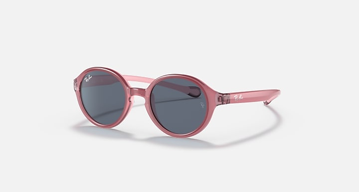 Ray-Ban round sunglasses with pink frame and dark gray lenses.