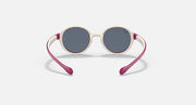 Ray-Ban round sunglasses with dark gray lenses, cream frame, and magenta arms