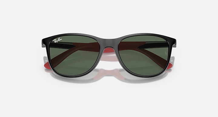 Ray-Ban sunglasses with black frame, dark green lenses, subtle red temple accents