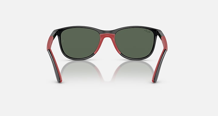 Red-accent Ray-Ban sunglasses with dark green lenses and angular frame corners