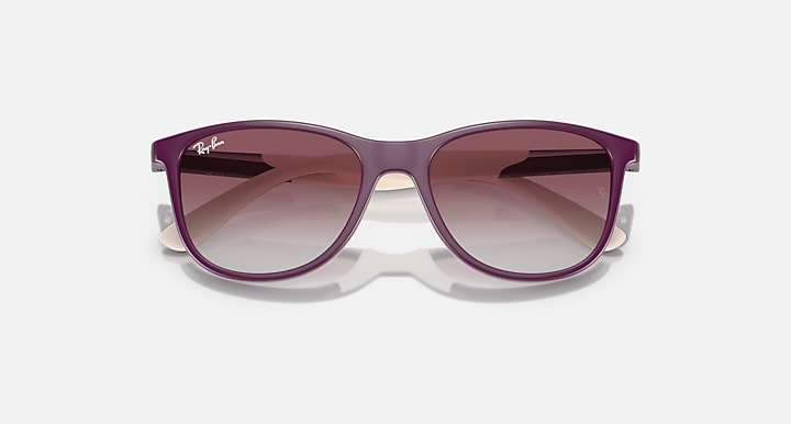 Ray-Ban sunglasses with dark purple frames and tinted gradient lenses