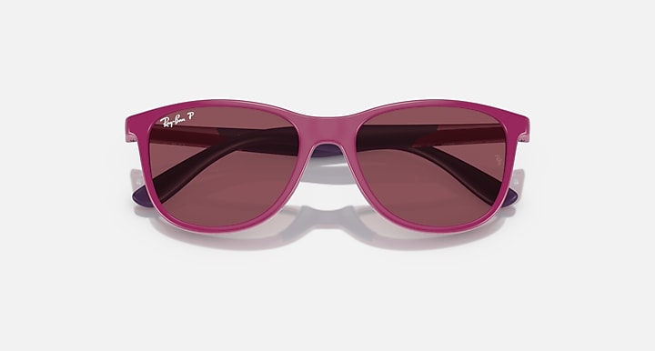 Pink Ray-Ban sunglasses with dark maroon-tinted lenses and glossy front frame