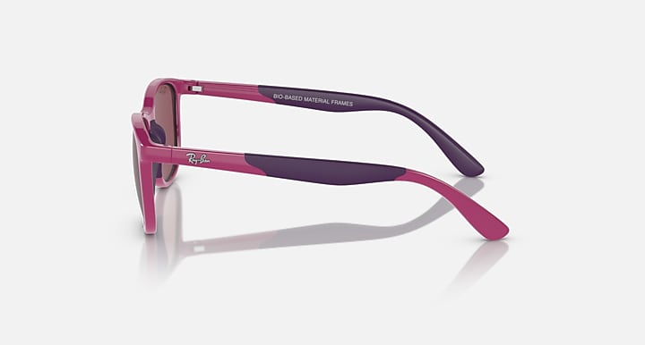 Pink and dark Ray-Ban sunglasses, side profile with rubberized arms and lens shield