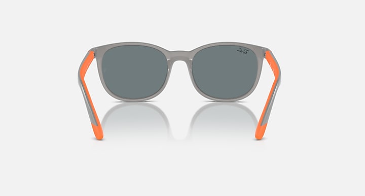 Grey sunglasses with dark lenses and orange rubber side arms