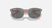 Grey sunglasses with dark brown-tinted lenses and orange accents