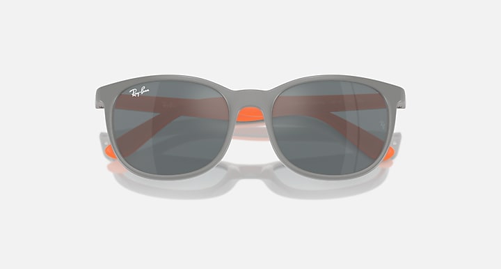 Grey sunglasses with dark brown-tinted lenses and orange accents