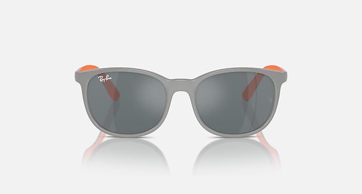 Grey sunglasses with dark gray lenses and orange side accents