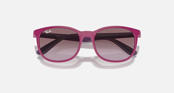 Purple sunglasses with dark gradient lenses and glossy frame finish