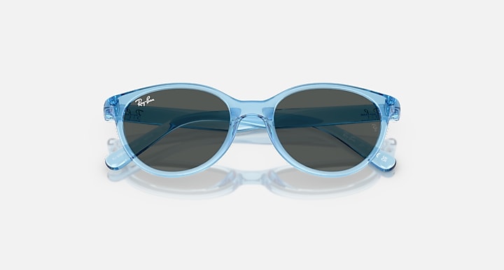 Transparent blue sunglasses with dark grey lenses, angled front