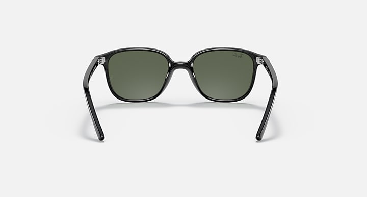 Dark green lens cat-eye sunglasses with dark frame and clear temple tips