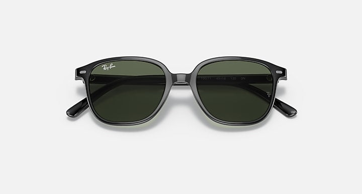 Dark lens cat-eye sunglasses with black frame and sculpted temple arms