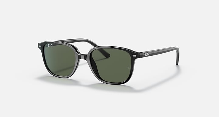 Dark green lens cat-eye sunglasses with clear-and-dark frame temples