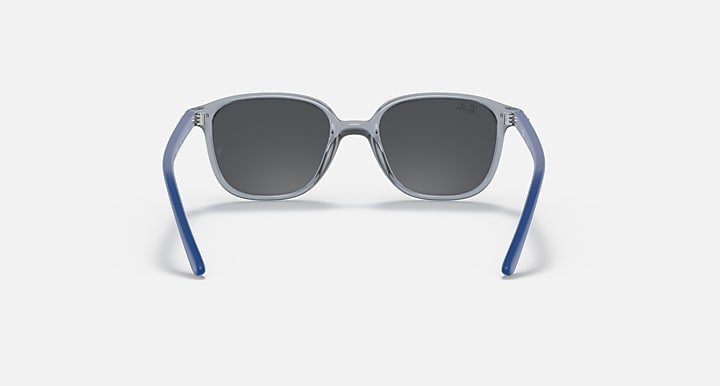 Dark lens cat-eye sunglasses with blue frame and clear top bar