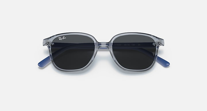 Dark lens cat-eye sunglasses with transparent blue frame and slim side temples