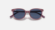 Ray-Ban Elliot RJ9097S sunglasses, angled top view, transparent pink frame with dark blue lenses