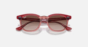 Ray-Ban transparent red cat-eye sunglasses with brown gradient lenses, angled view