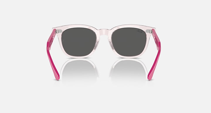 Ray-Ban RJ9098SF sunglasses front view, clear light pink frame with dark lenses
