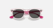 Ray-Ban RJ9098SF sunglasses front view with pink translucent frames and dark lenses