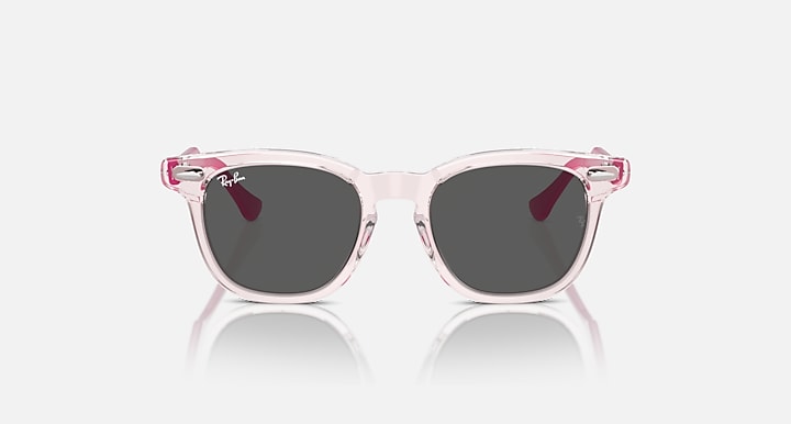 Ray-Ban RJ9098SF sunglasses front view, clear pink frames with dark tinted lenses