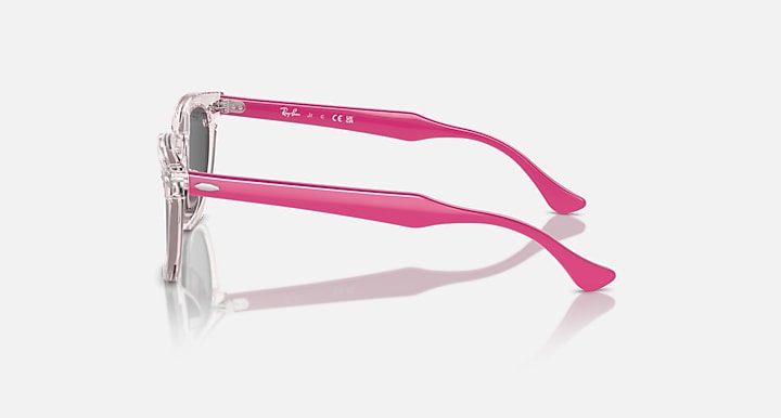 Ray-Ban RJ9098SF sunglasses side view with hot pink translucent arms and dark lens