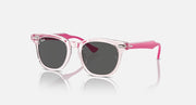 Ray-Ban RJ9098SF sunglasses with pink translucent frames and dark charcoal lenses