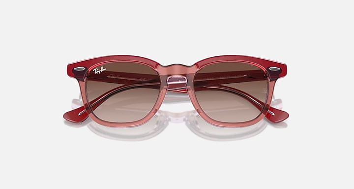 Ray-Ban sunglasses with red-pink frame and dark brown lenses, front view