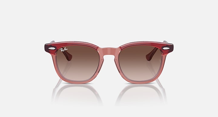 Ray-Ban sunglasses with rose-pink frame and tinted brown lenses, front view