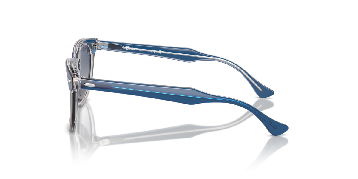 Ray-Ban kids sunglasses, blue frame with dark gradient lenses, side profile view.