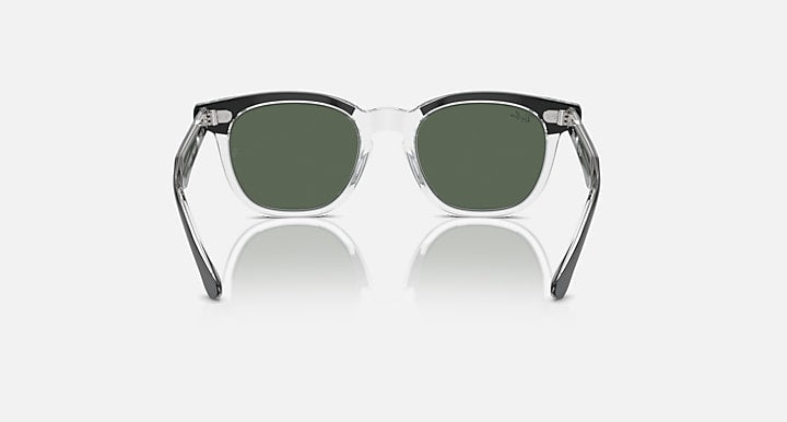 Ray-Ban RJ9098S sunglasses with transparent frame and dark green lenses, symmetrical front view
