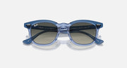 Ray-Ban RJ9098S sunglasses with light blue transparent frame and dark blue lenses, angled front view