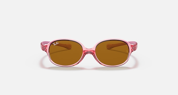 Pink oval sunglasses with brown tinted lenses and glossy round nose bridge