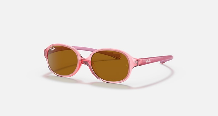 Pink transparent oval sunglasses with brown tinted lenses and slim temples